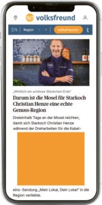 Ein Smartphone mit der Ansicht des Werbemittels "Medium Rectangle" in der News-App des Trierischen Volksfreund wird dargestellt.